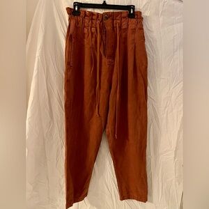 Free People Margate pleated paper bag trousers in a size medium tamarind color